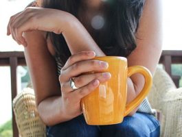 woman taking coffee break: photo link to parent carer breaks in Cambridgeshire